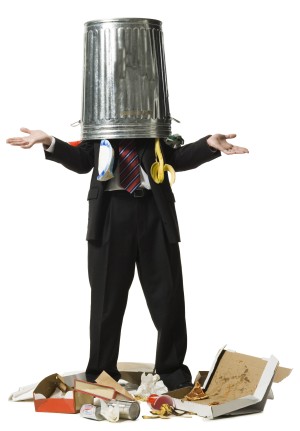 Businessman with trash can on head